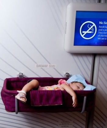 Baby in bassinet on long haul flight