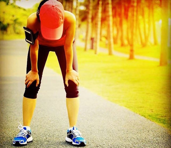 Woman bending over after running