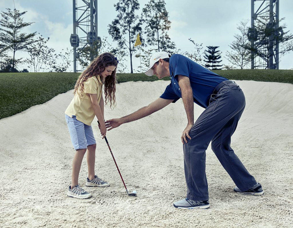 HKGTA Golf lessons girl with coach
