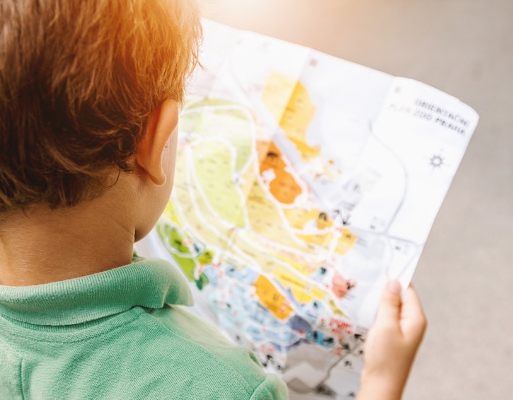 Child with map treasure hunt