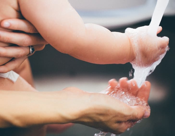 Child washing hand