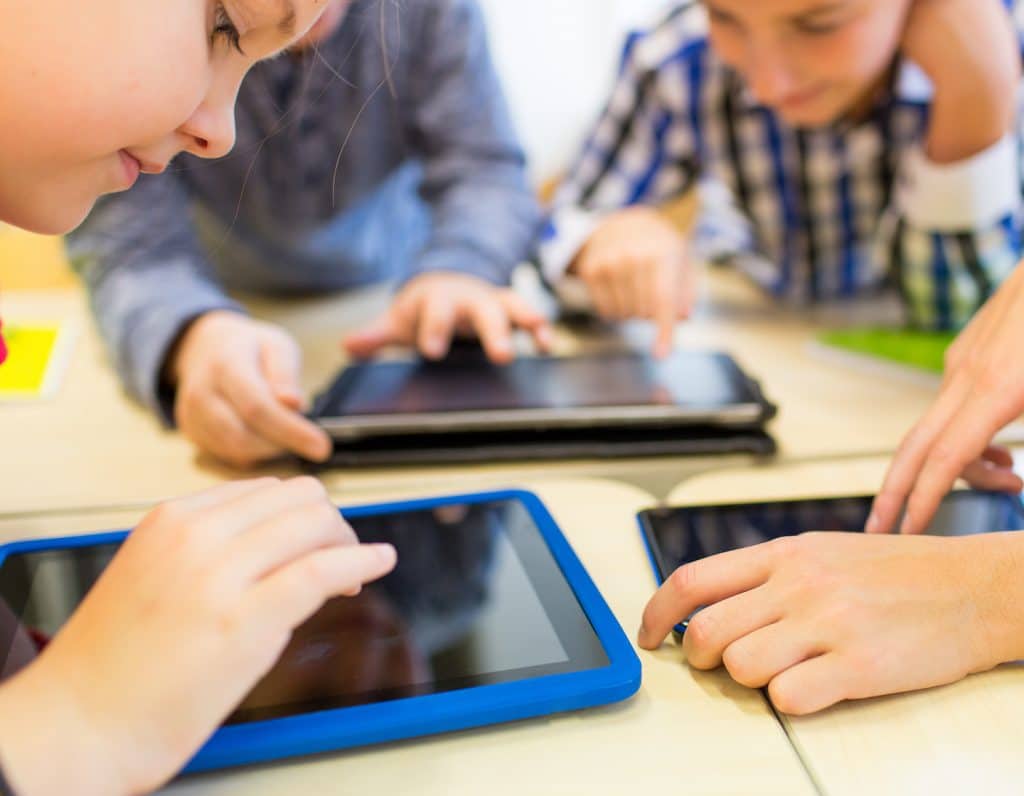 Kids using apps on tablets