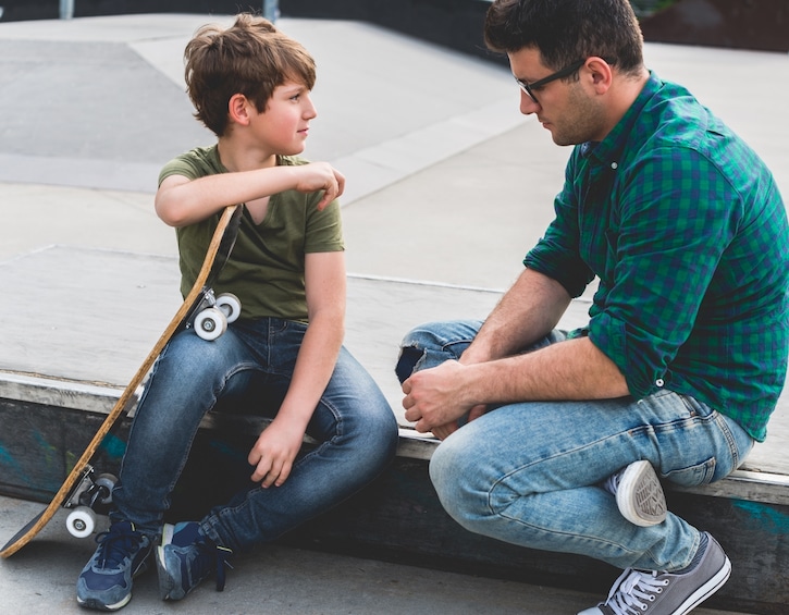 boy talking to father