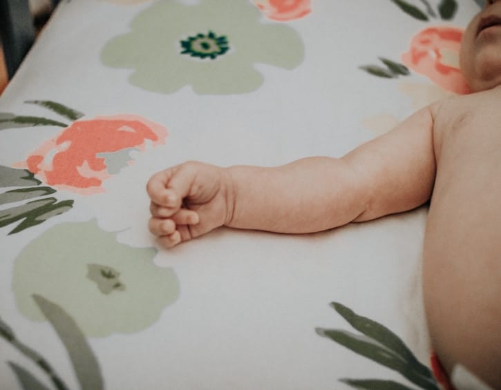 baby laying in bed