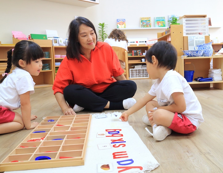 An IMS teacher with students