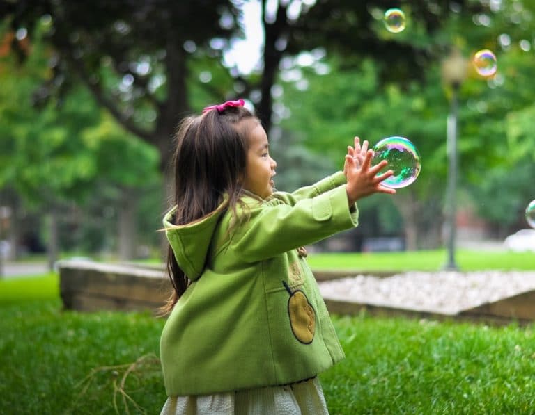 whats on girl playing bubbles