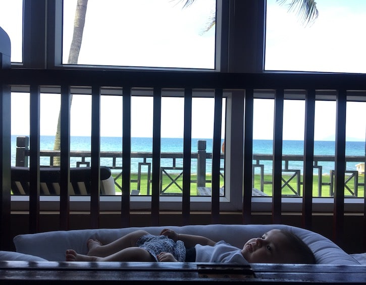 newborn baby asleep by the window in a beach resort