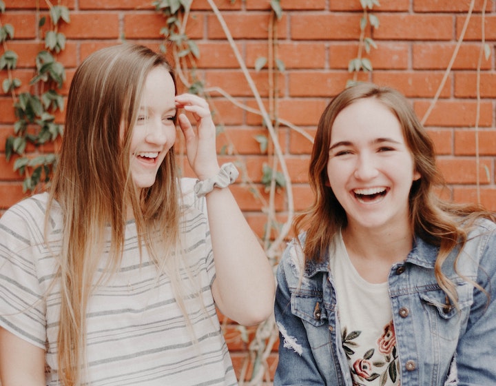 Understanding teens, two teenage girls having a giggle