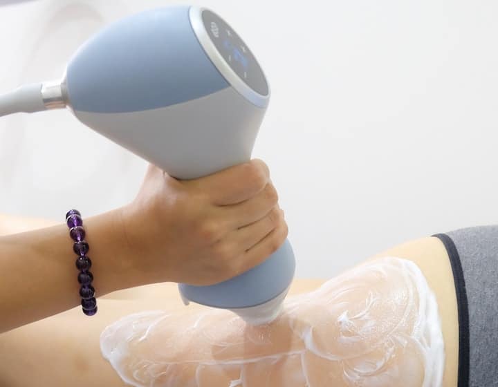 EMTONE machine used on thighs at High Society Skin Clinic