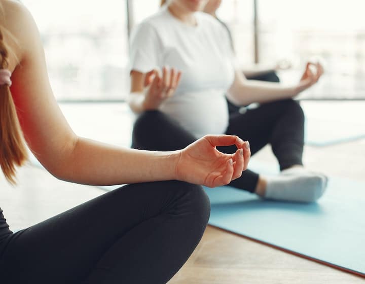 Prenatal yoga poses to try at home women meditating