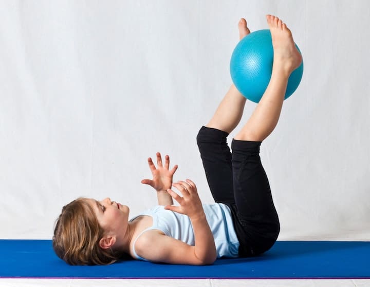 child doing exercise at home