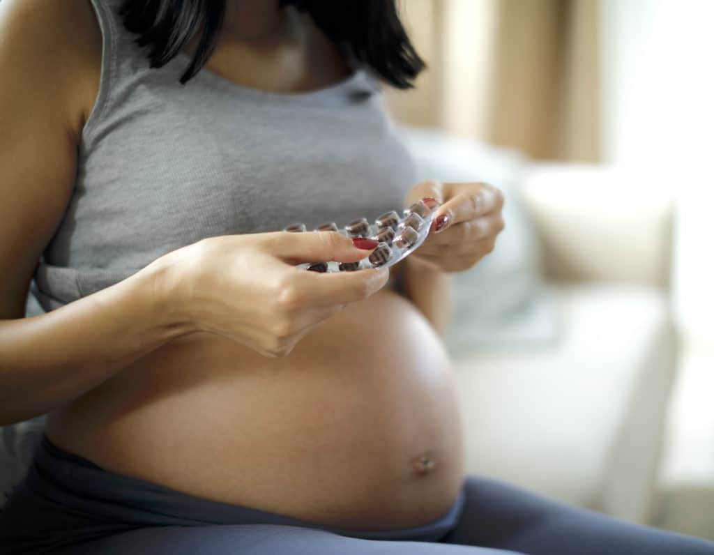 mama taking prenatal vitamins in Hong Kong