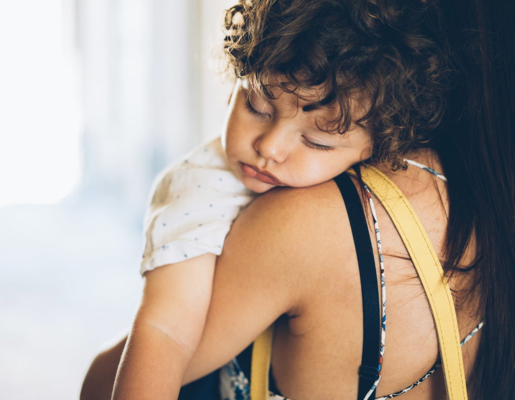 Toddler sleep issues, little boy sleeping on his mamas shoulder