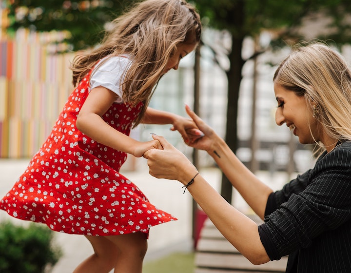 Mama and daughter playing outside