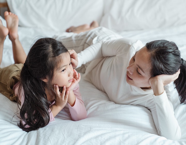 Mother telling her daughter family memories