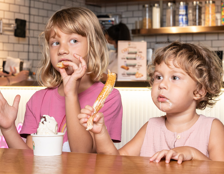 that papa juan gimenez kids enjoying churros