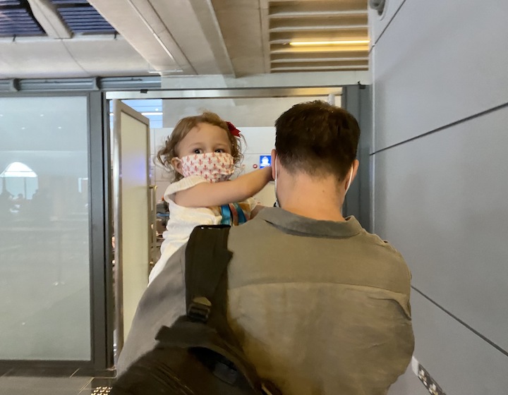 Health and safety on a cruise in Hong Kong, toddler with a face mask