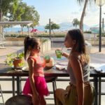 mother and daughter enjoying a drink at Limewood restaurant overlooking repulse bay beach
