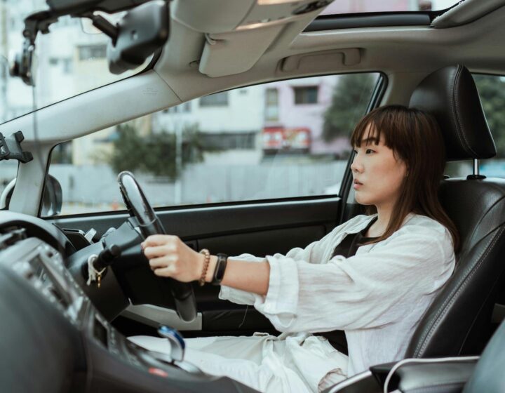 an asian woman learns to drive in Hong Kong
