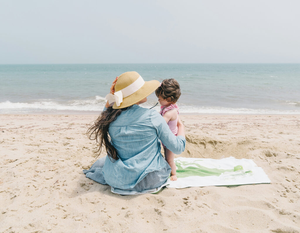 mother and child on a beach, best beaches in hong kong to visit with the family kid friendly beach hk