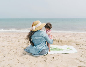 mother and child on a beach, best beaches in hong kong to visit with the family kid friendly beach hk