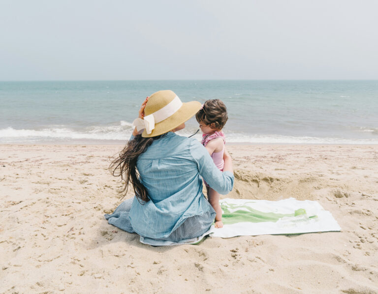 mother and child on a beach, best beaches in hong kong to visit with the family kid friendly beach hk