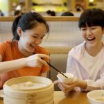 kids enjoying yum cha dishes at dim sum in Hong Kong