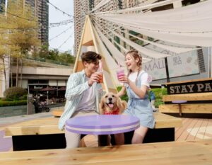 The Best Pet-Friendly Malls In Hong Kong, two people with dog at dog park with sitting area