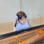 Inspiro Music Conservatoire Academy Education Wong Chuk Hang Sassy Mama Girl at Piano