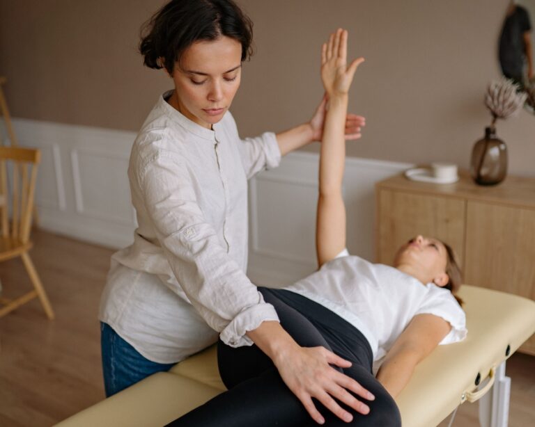 female Physiotherapist in hong kong stretching out a woman