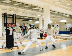 hong kong fencing schools for kids, two fencing students in a tournament in HK