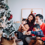 Asian family decorating Christmas tree in HK