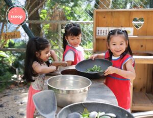 three students at small world christan kindergarten, open day in hong kong school