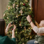 family decorating a christmas tree, where to buy christmas trees in hong kong