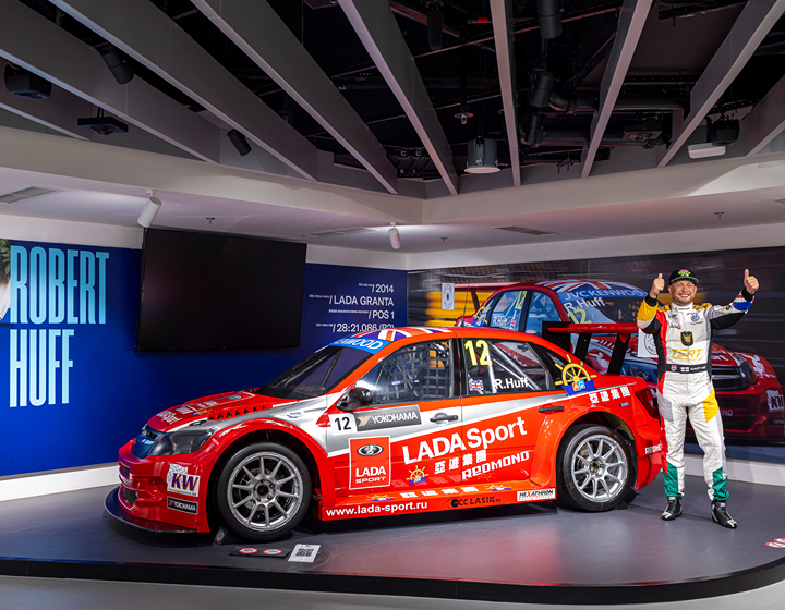 Things To Do In Macau With Kids: Macau Grand Prix Museum, f1 car and wax figure of driver at GP museum in Macao