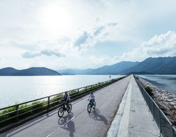 a family cycle at Tei Mei Tuk near tai po in Hong Kong