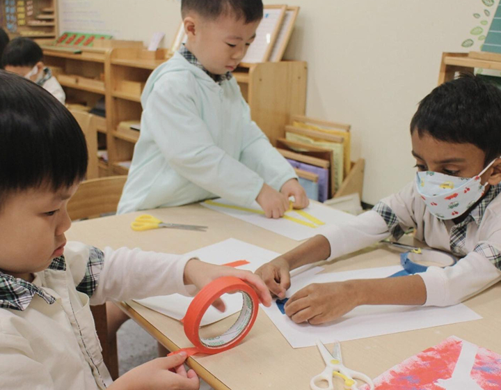 island christian montessori school hong kong; three children in montessori class