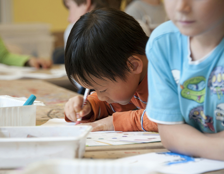 what is a montessori education, montessori method; young boy in montessori classroom