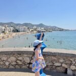 girl looking at the beach in Sitges