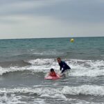 boy learning to surf in Spain