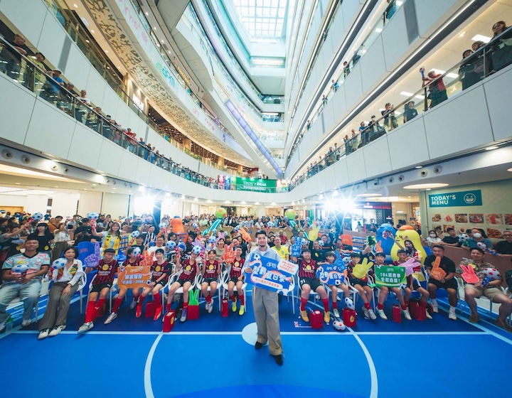 a crowd gathers to watch the fifa football World Cup at 7pm mall in Kwun Tong Hong Kong