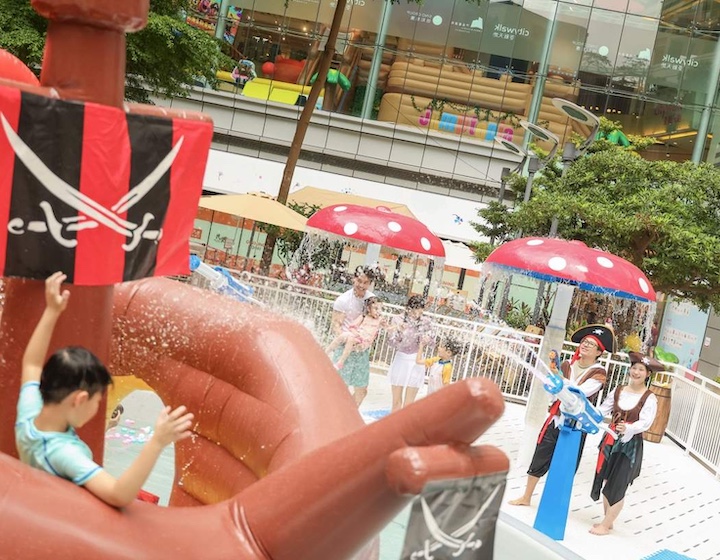 a boy plays on an outdoor splash area at kidztopia splash in City Walk Tsuen Wan