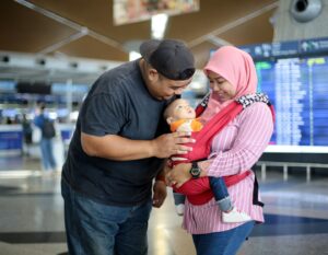 new parents travel with their newborn baby for the first time
