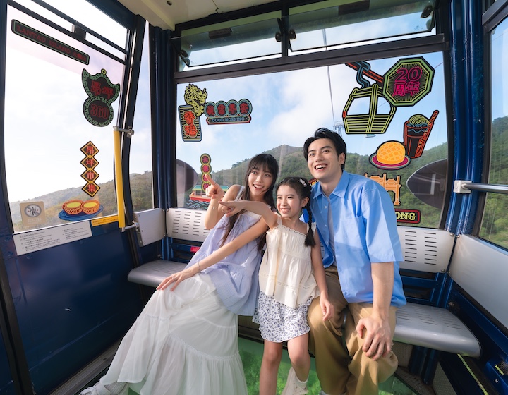 a family ride the ngong ping 360 cable car with the new neon lights theme