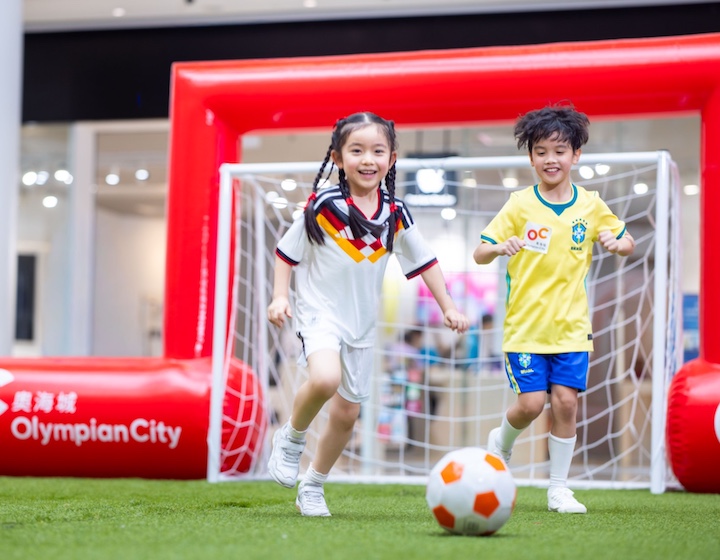 two children play football at Olympian city Hong Kong to celebrate the World Cup 2026