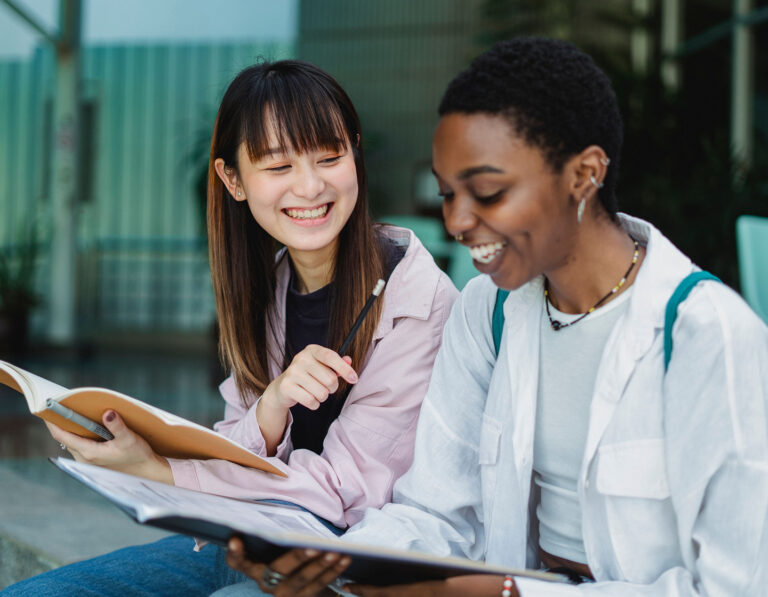 two female students in a school, getting school news in hong kong 2026