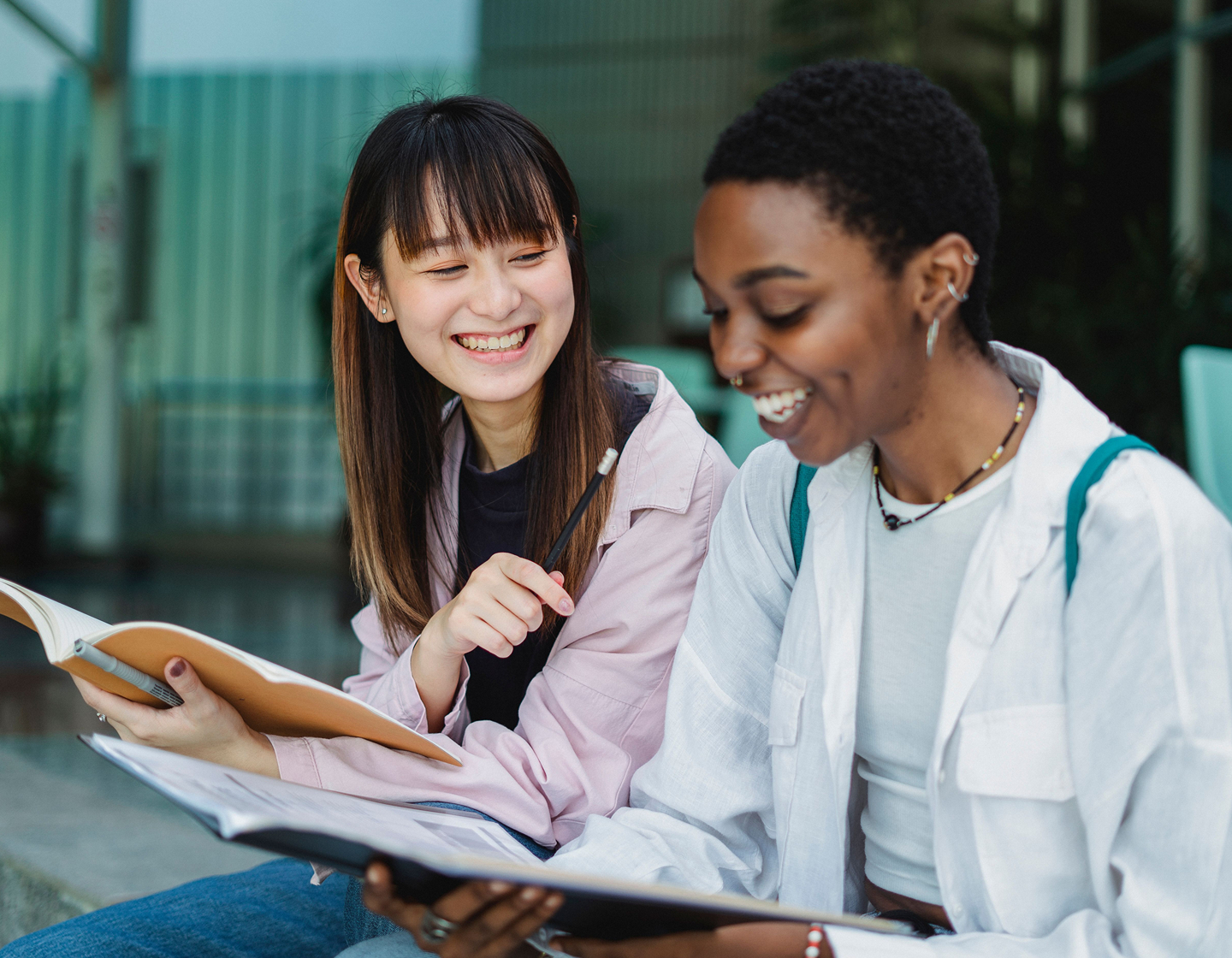 two female students in a school, getting school news in hong kong 2026