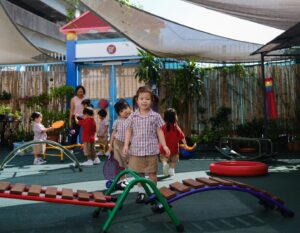esf tsing yi kindergarten student plays knowing she has a guaranteed pathway to primary school