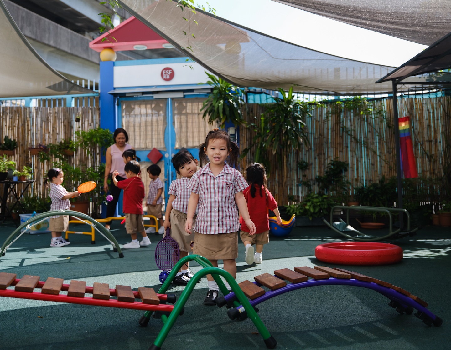 esf tsing yi kindergarten student plays knowing she has a guaranteed pathway to primary school