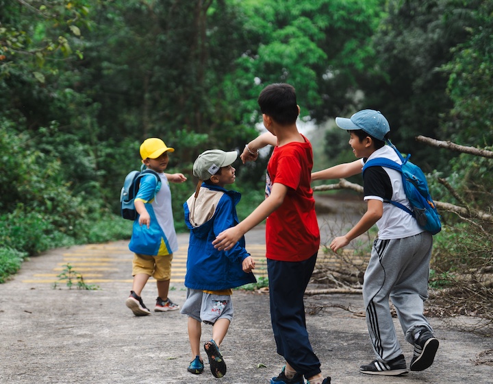four Hong Kong boys playing at a forrest school ECA in Hong Kong